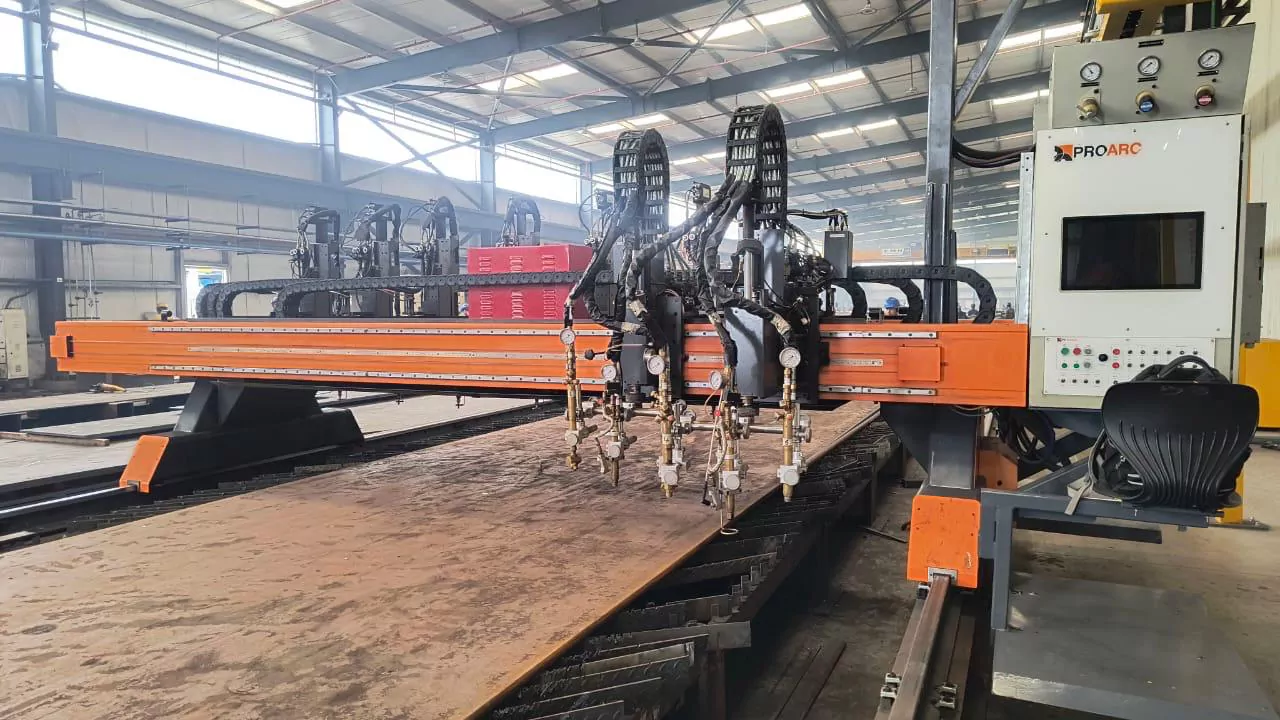 In-house factory fabrication: CNC plasma cutting machine cutting a structural steel plate at Krishnan Metals factory
